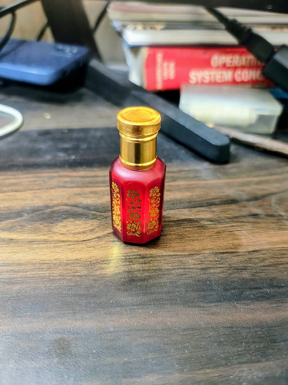 Small red bottle with gold cap containing 6gm of zafrani musk